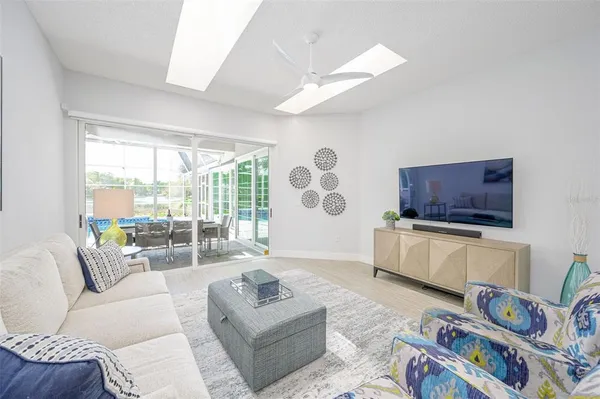 a living room with furniture and flat screen tv