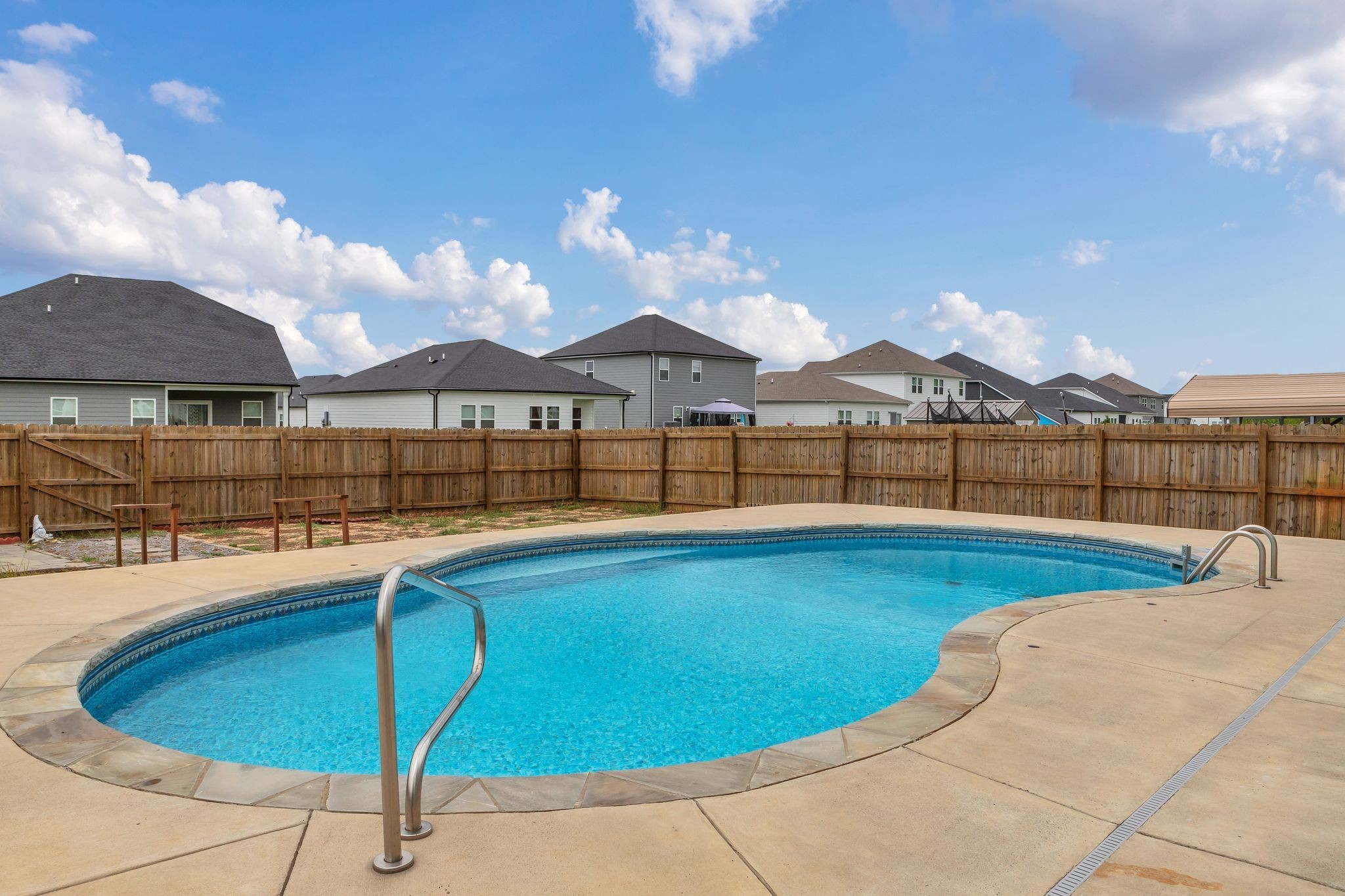 3734 Spahn Lane Murfreesboro, TN 37128 - Photo 3 of 25 a view of a swimming pool with lounge chair