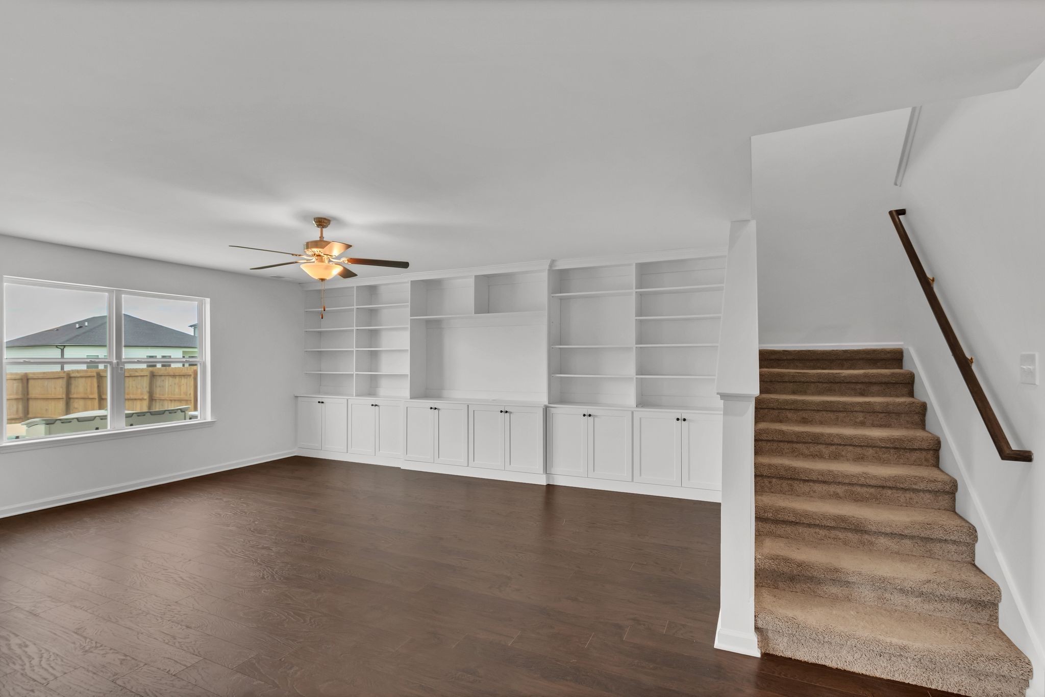 3734 Spahn Lane Murfreesboro, TN 37128 - Photo 7 of 25 an empty room with wooden floor and windows