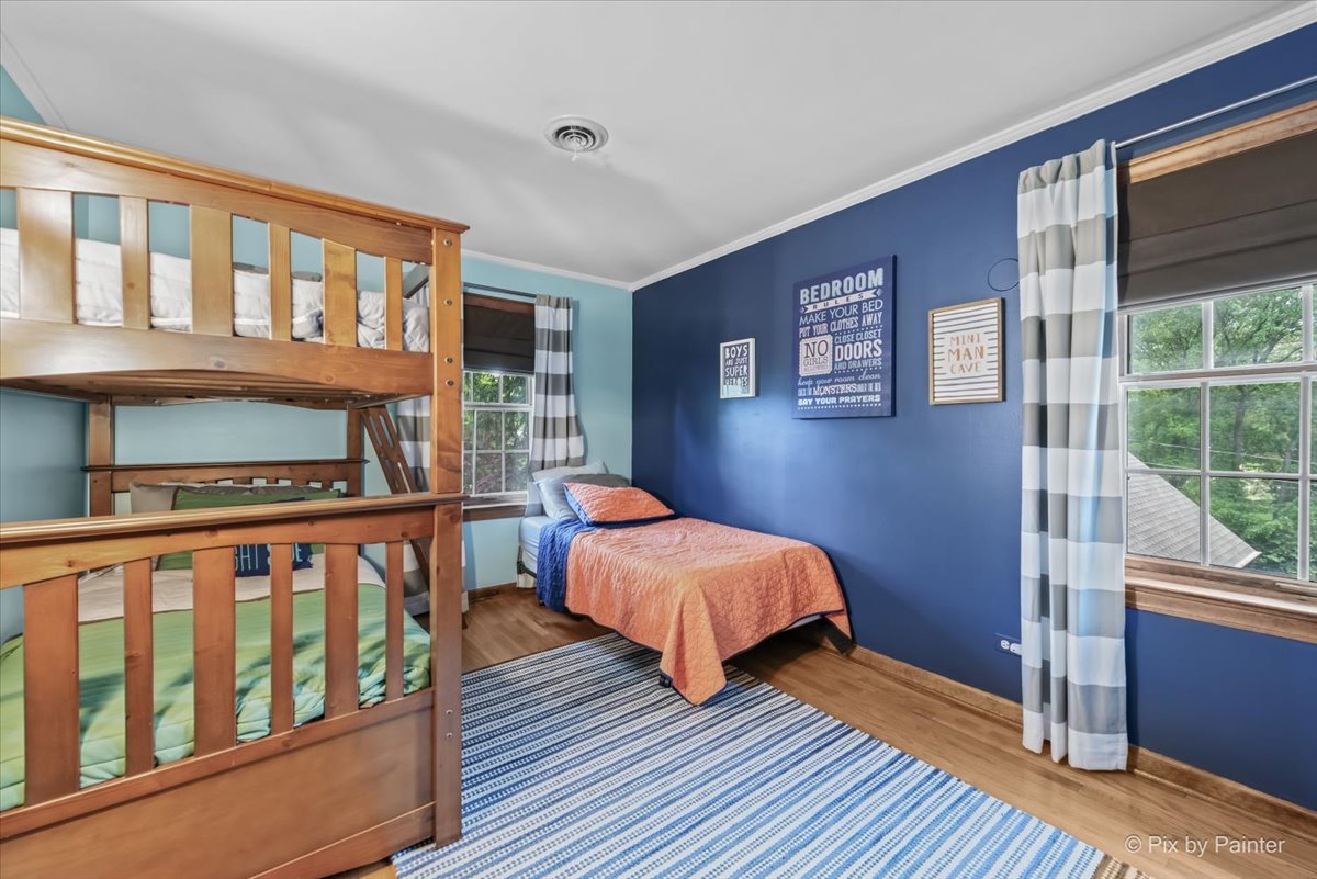 335 Arlington Road Itasca, IL 60143 - Photo 16 of 36 a bedroom with two beds and a window