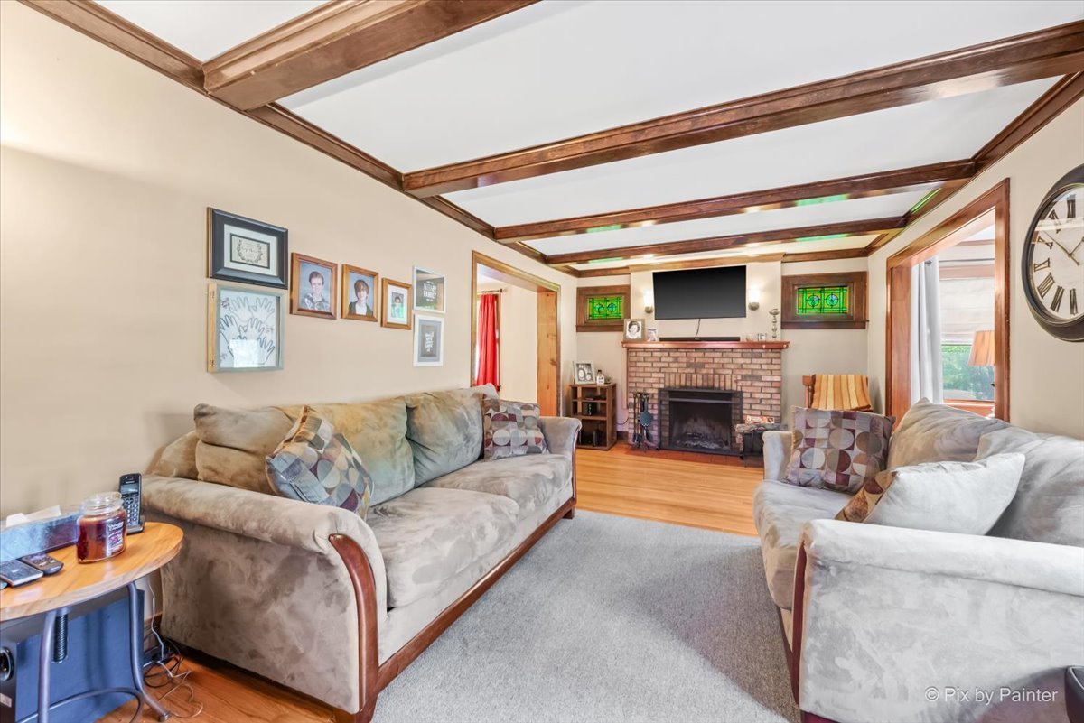 335 Arlington Road Itasca, IL 60143 - Photo 2 of 36 a living room with furniture and a fireplace