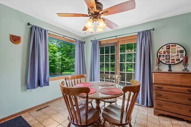 a view of a dining room with furniture window and outside view