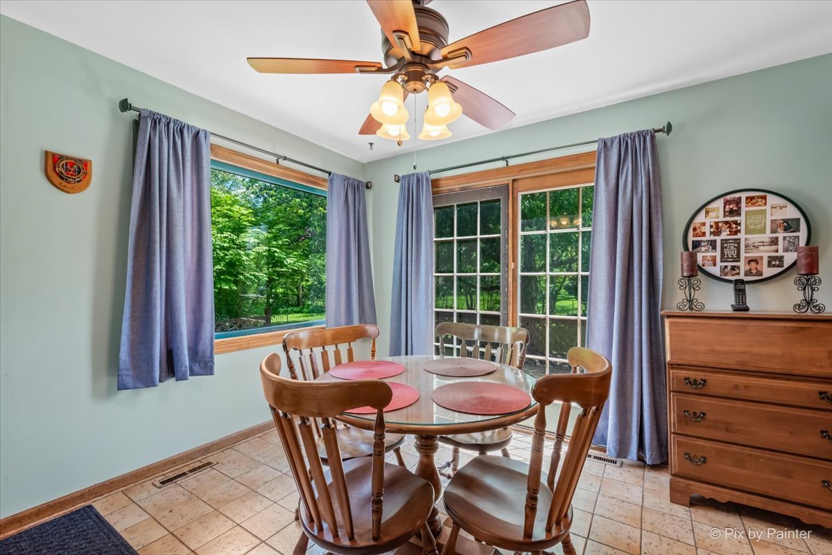 335 Arlington Road Itasca, IL 60143 - Photo 8 of 36 a view of a dining room with furniture window and outside view