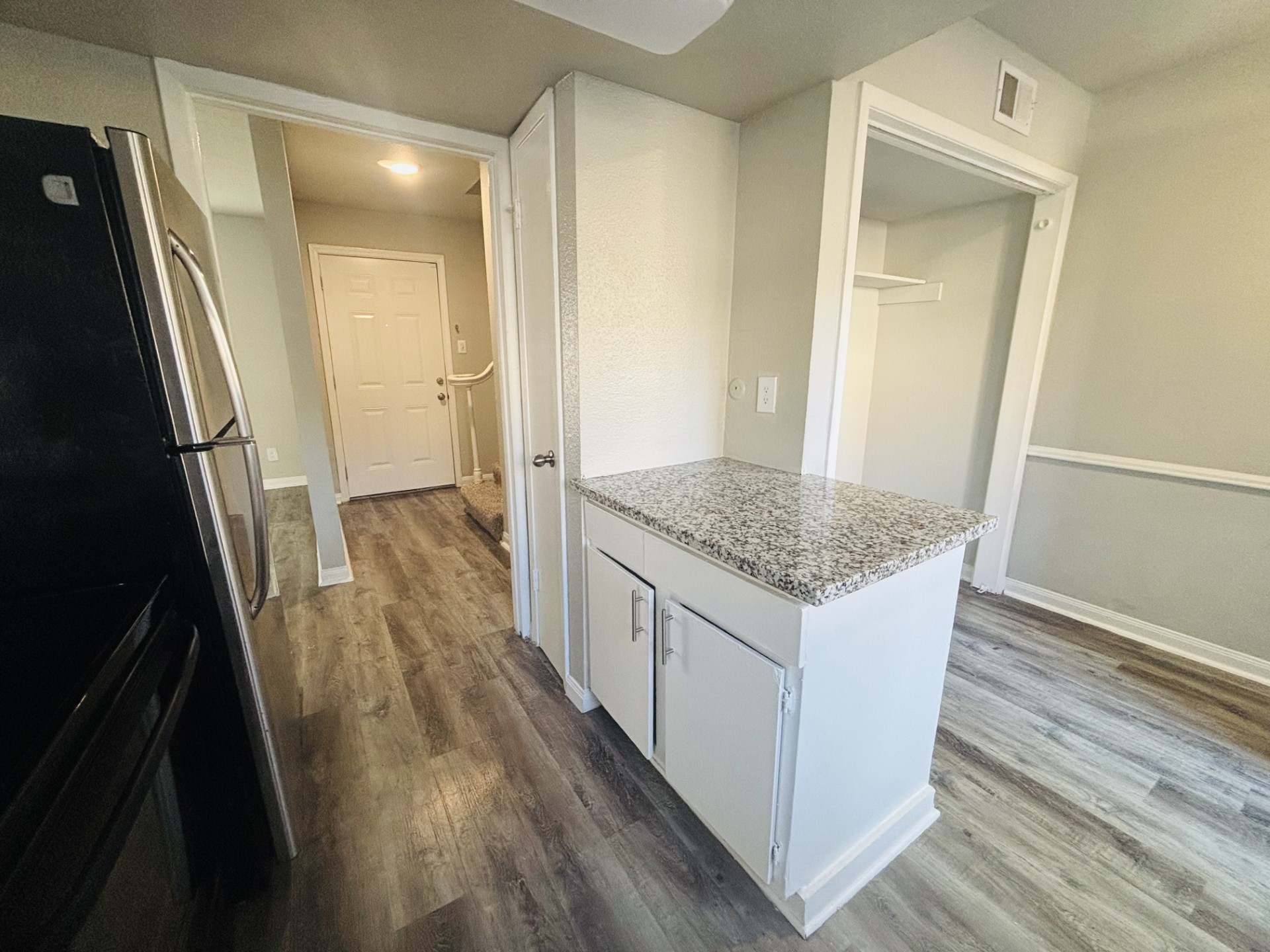 6200 West Tidwell Road, Unit 1109 Houston, TX 77092 - Photo 3 of 20 wooden floor in an empty room with wooden floor