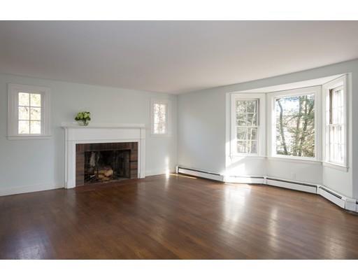 338 Conant Road Weston, MA 02493 - Photo 2 of 11 a view of an empty room with wooden floor fireplace and a window