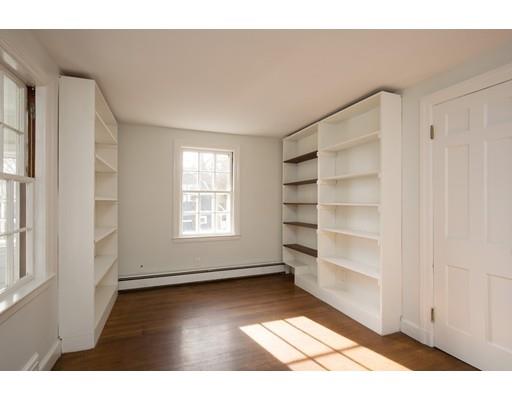 338 Conant Road Weston, MA 02493 - Photo 6 of 11 a view of an empty room with a window
