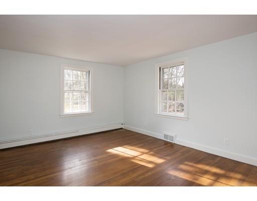 338 Conant Road Weston, MA 02493 - Photo 7 of 11 an empty room with wooden floor and windows