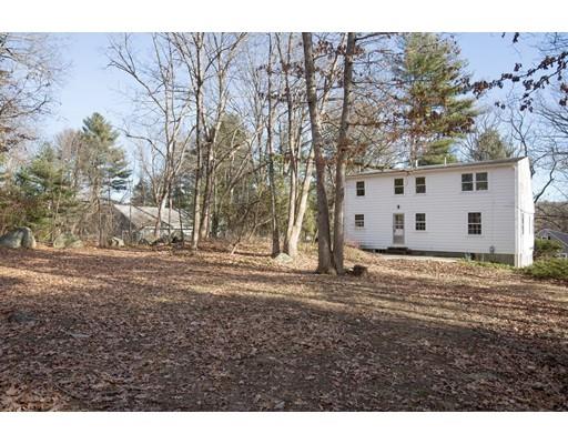 338 Conant Road Weston, MA 02493 - Photo 10 of 11 a view of a backyard with large trees