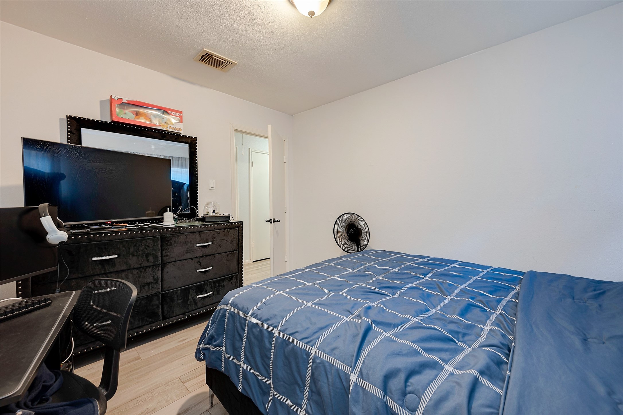 2226 Gray Hawk Lane Katy, TX 77449 - Photo 12 of 16 a bedroom with a bed and a flat screen tv