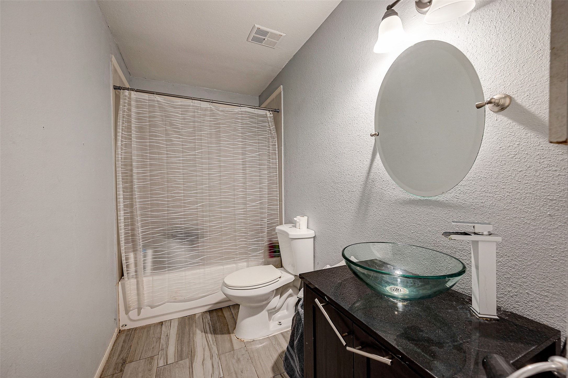 2226 Gray Hawk Lane Katy, TX 77449 - Photo 14 of 16 a bathroom with a sink and a mirror