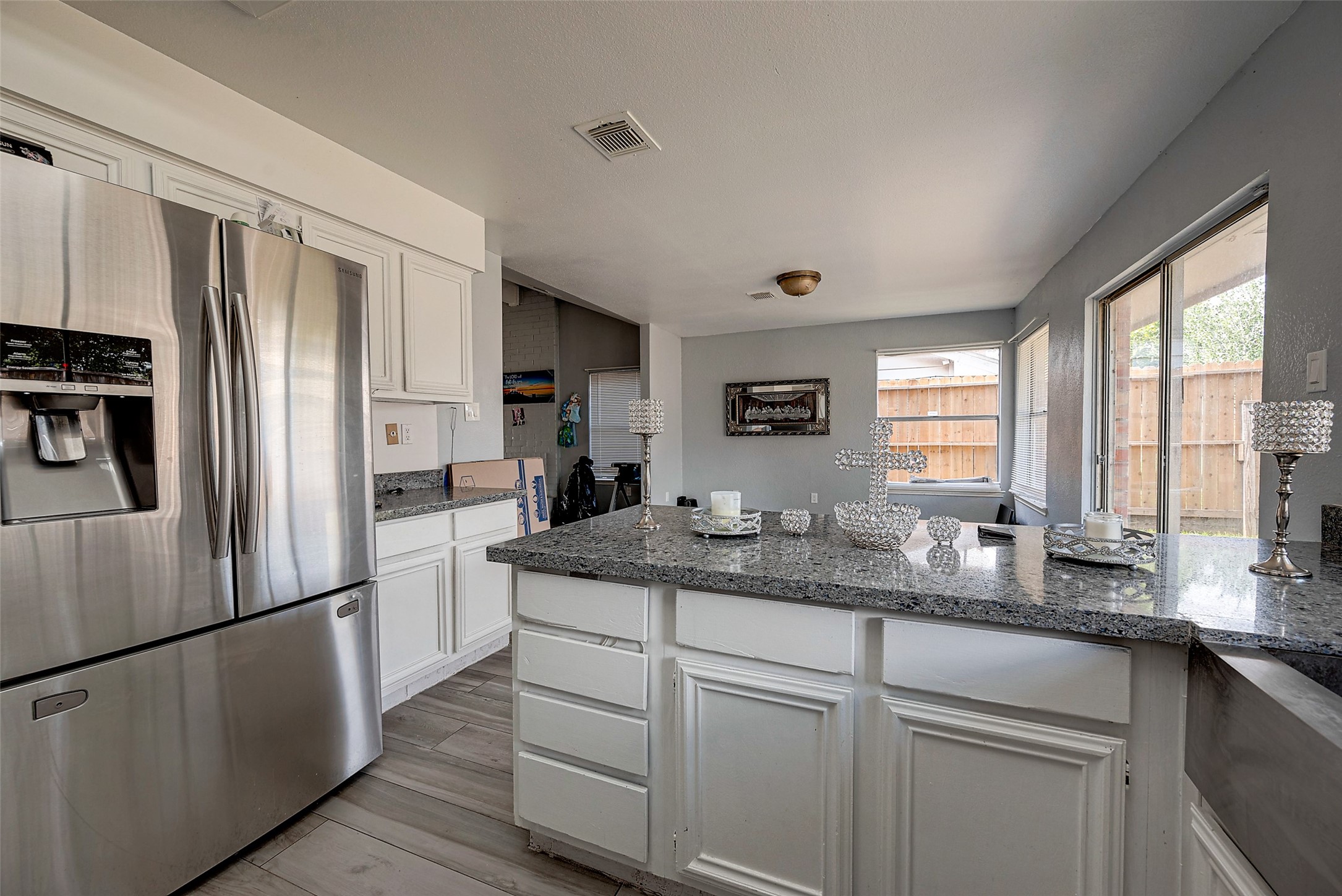 2226 Gray Hawk Lane Katy, TX 77449 - Photo 5 of 16 a kitchen with a refrigerator and windows