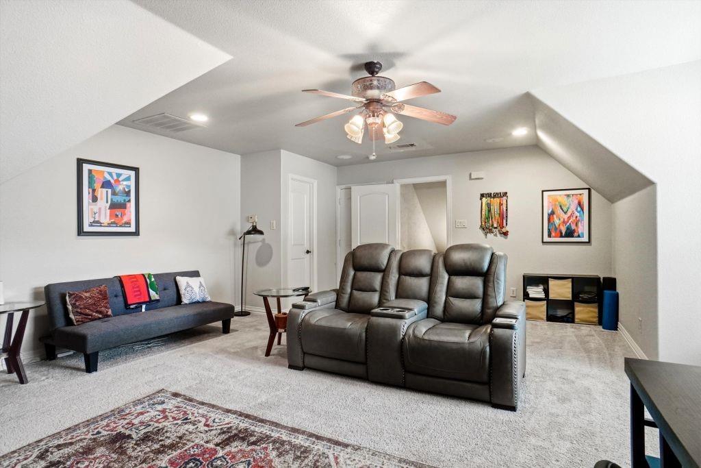 620 Highview Lane Hurst, TX 76054 - Photo 35 of 40 a living room with furniture ceiling fan and a rug
