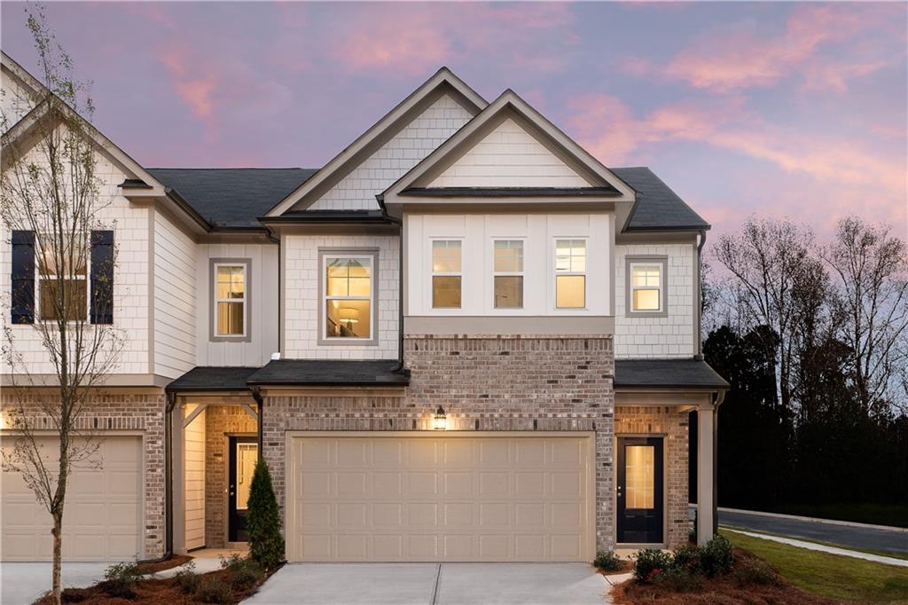 1397 Ben Park Way, Unit 1397 Grayson, GA 30017 - Photo 1 of 1 a front view of a house with a yard