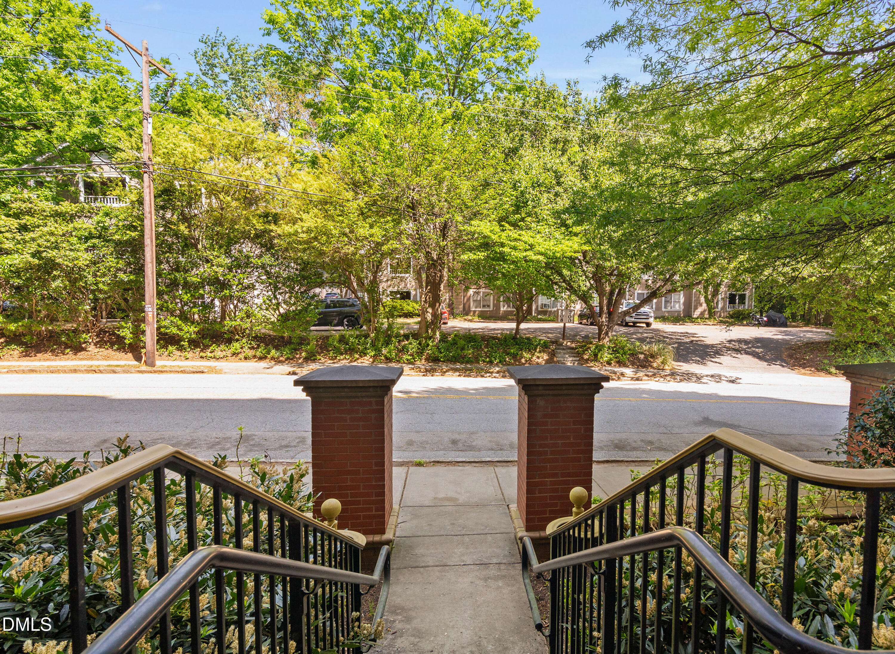 710 Independence Place, Unit 104 Raleigh, NC 27603 - Photo 34 of 34 a view of a balcony with wooden floor and outdoor space