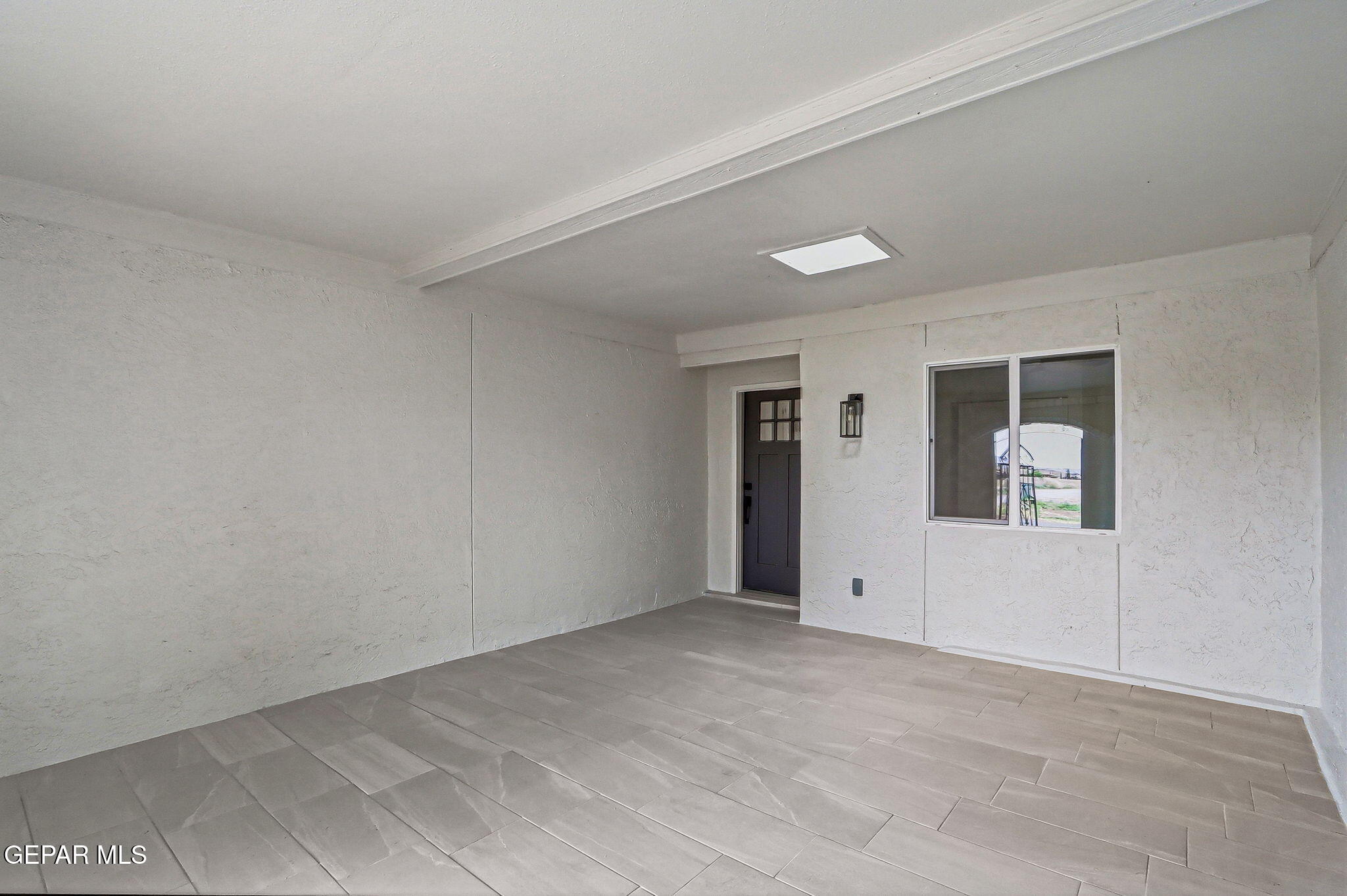 709 Frontera Road El Paso, TX 79922 - Photo 5 of 41 an empty room with windows