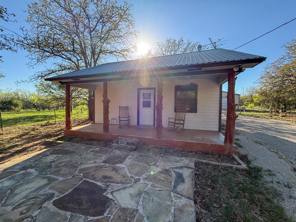 4909 Barton Chapel Road Jacksboro, TX 76458 - Photo 11 of 37 a view of a house with backyard and porch
