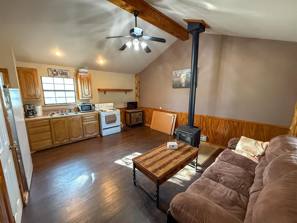 4909 Barton Chapel Road Jacksboro, TX 76458 - Photo 13 of 37 a living room with furniture and a chandelier