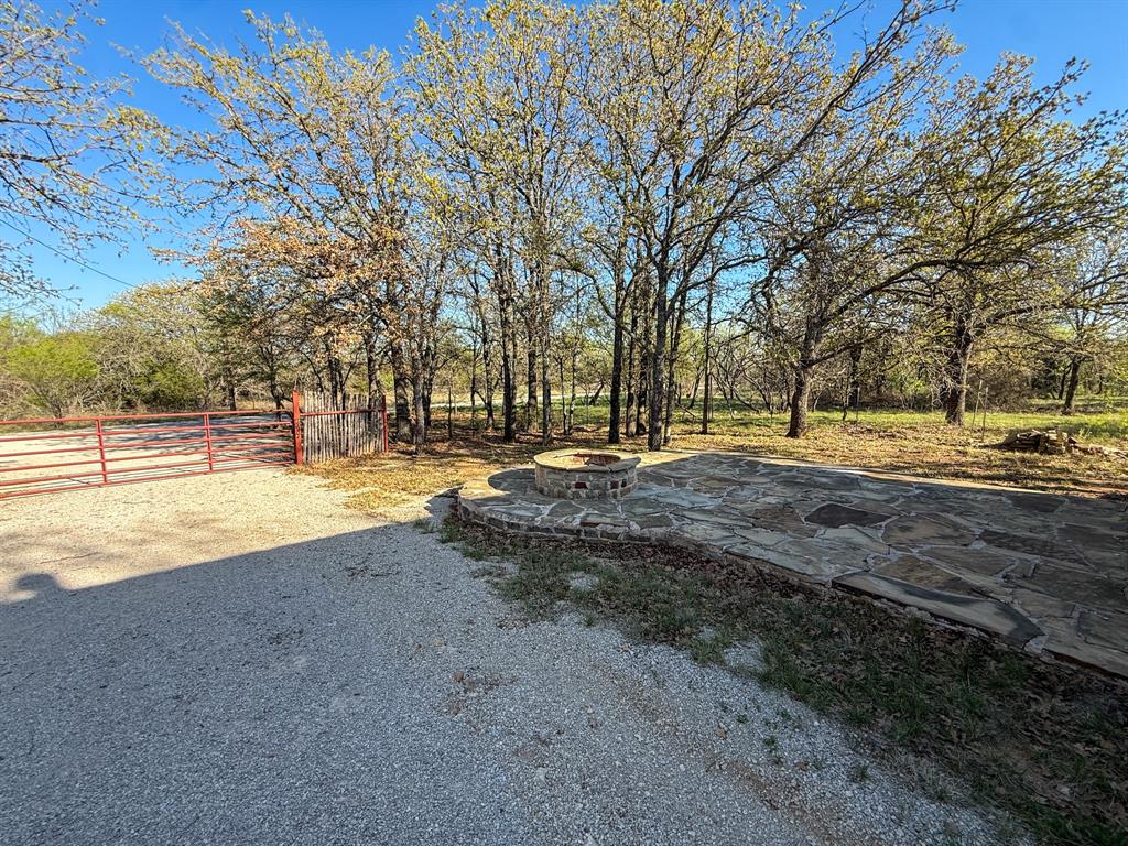 4909 Barton Chapel Road Jacksboro, TX 76458 - Photo 26 of 37 a view of road with large trees