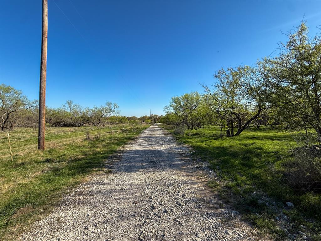 4909 Barton Chapel Road Jacksboro, TX 76458 - Photo 27 of 37 a view of a yard with an ocean view