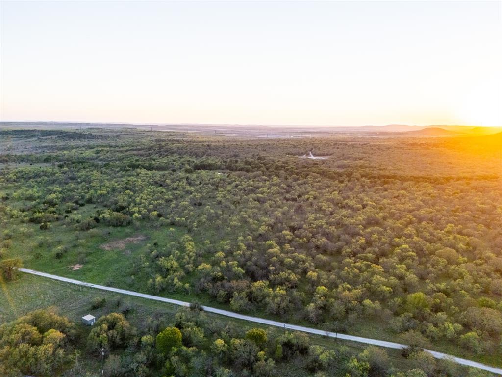 4909 Barton Chapel Road Jacksboro, TX 76458 - Photo 29 of 37 a view of a green field with an outdoor space