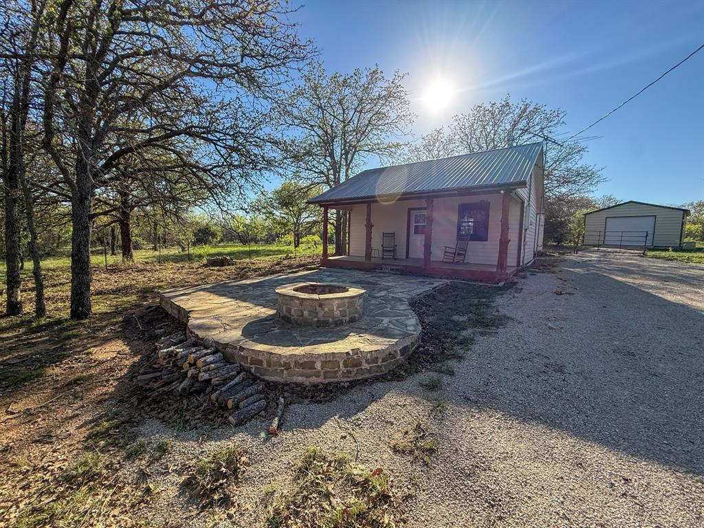 4909 Barton Chapel Road Jacksboro, TX 76458 - Photo 9 of 37 a view of a house with backyard and sitting area