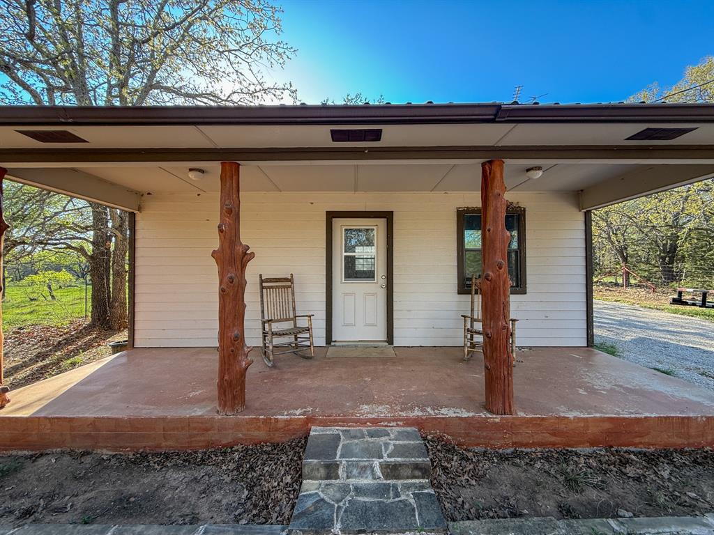 4909 Barton Chapel Road Jacksboro, TX 76458 - Photo 10 of 37 a front view of a house with a yard
