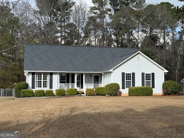 247 Southern Walk Circle Gray, GA 31032 - Photo 1 of 1 a front view of a house with a garden
