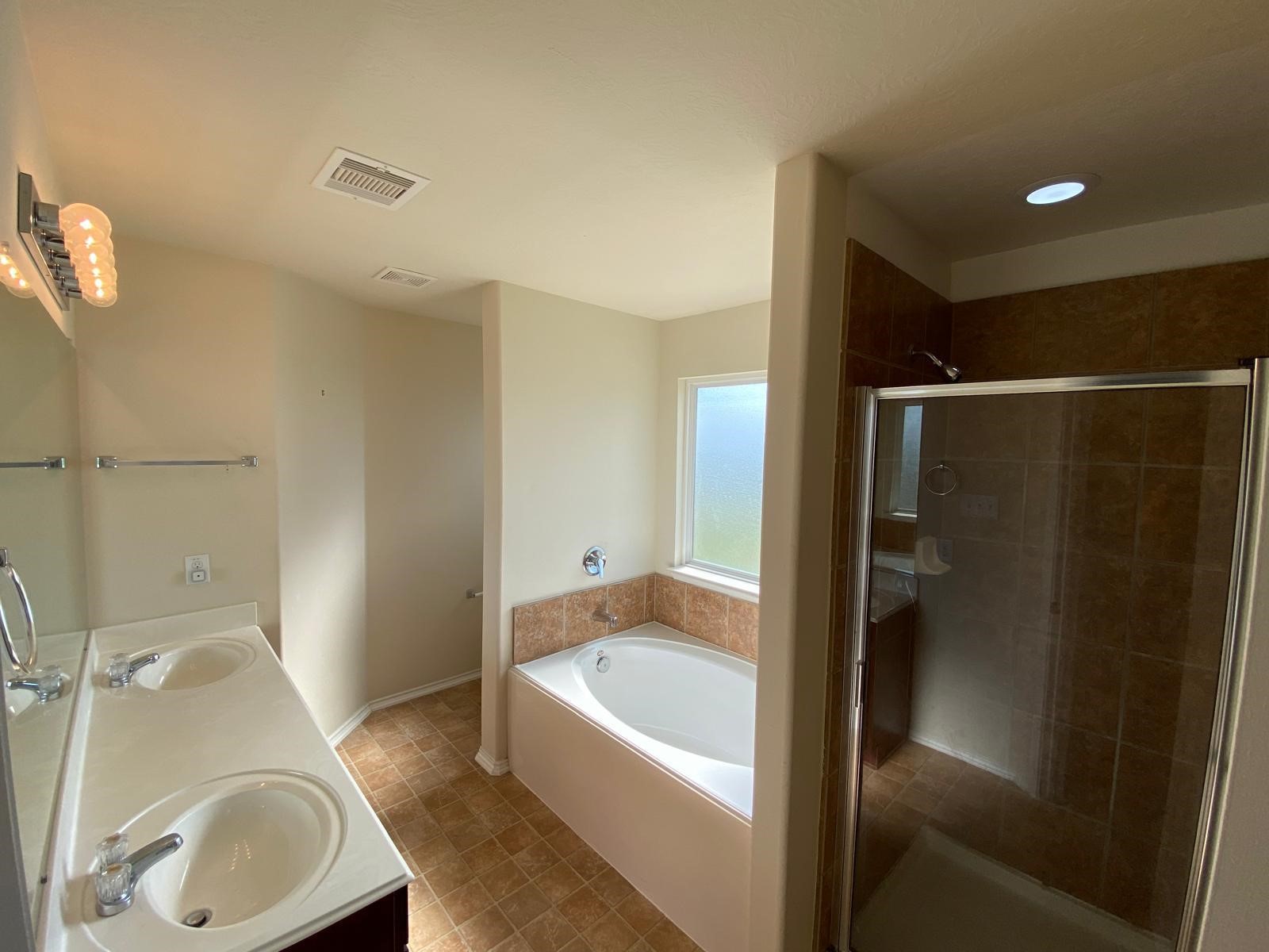 1515 Daffodil Road Missouri City, TX 77489 - Photo 13 of 20 a bathroom with a sink a toilet and shower