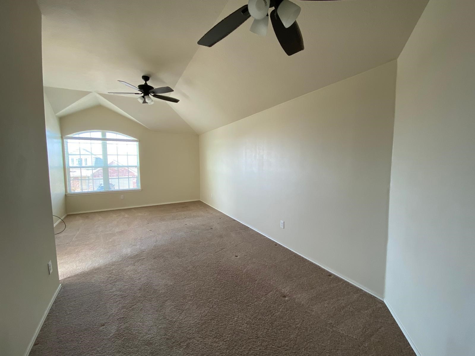 1515 Daffodil Road Missouri City, TX 77489 - Photo 15 of 20 an empty room with windows and fan