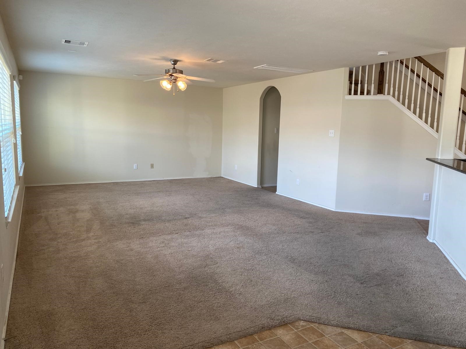 1515 Daffodil Road Missouri City, TX 77489 - Photo 6 of 20 a view of a livingroom with a ceiling fan