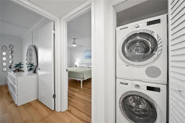a view of a hallway with washer and dryer