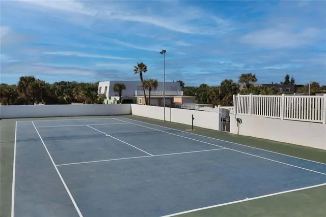 a view of pool table and chairs in patio