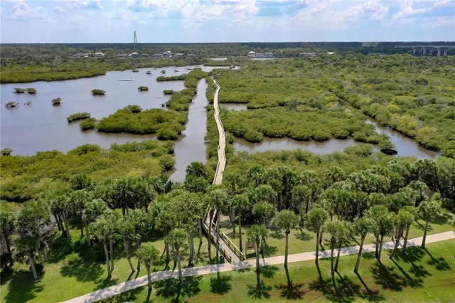an aerial view of a city with lake view