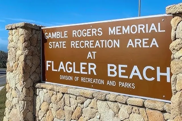 a view of a sign board with a small yard