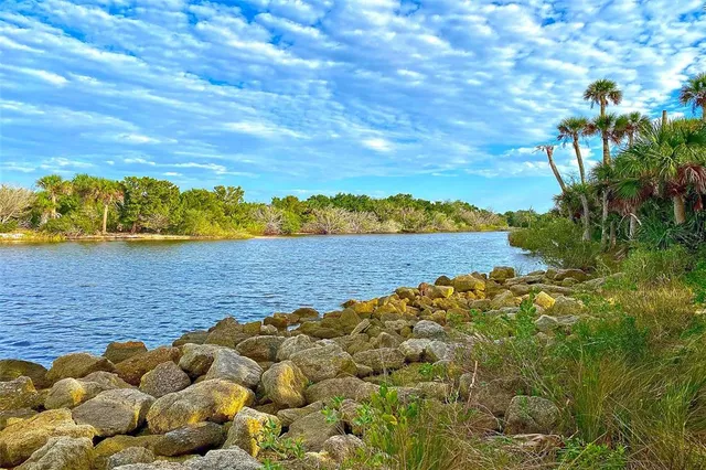 an aerial view of a residential houses with outdoor space