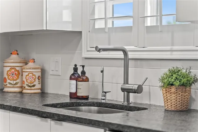 a kitchen with a sink and a stove