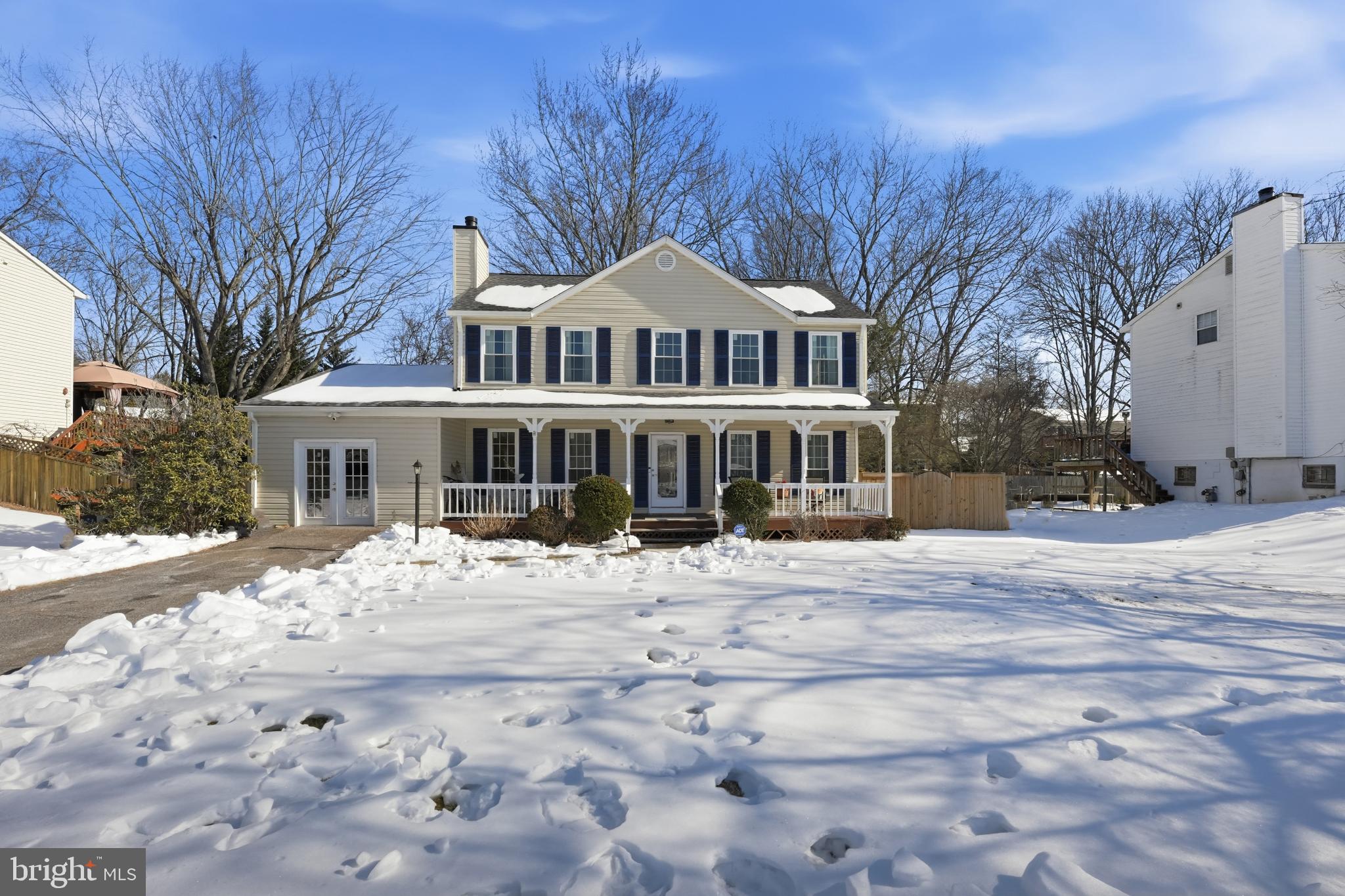 Charming home nestled in a winter wonderland.
