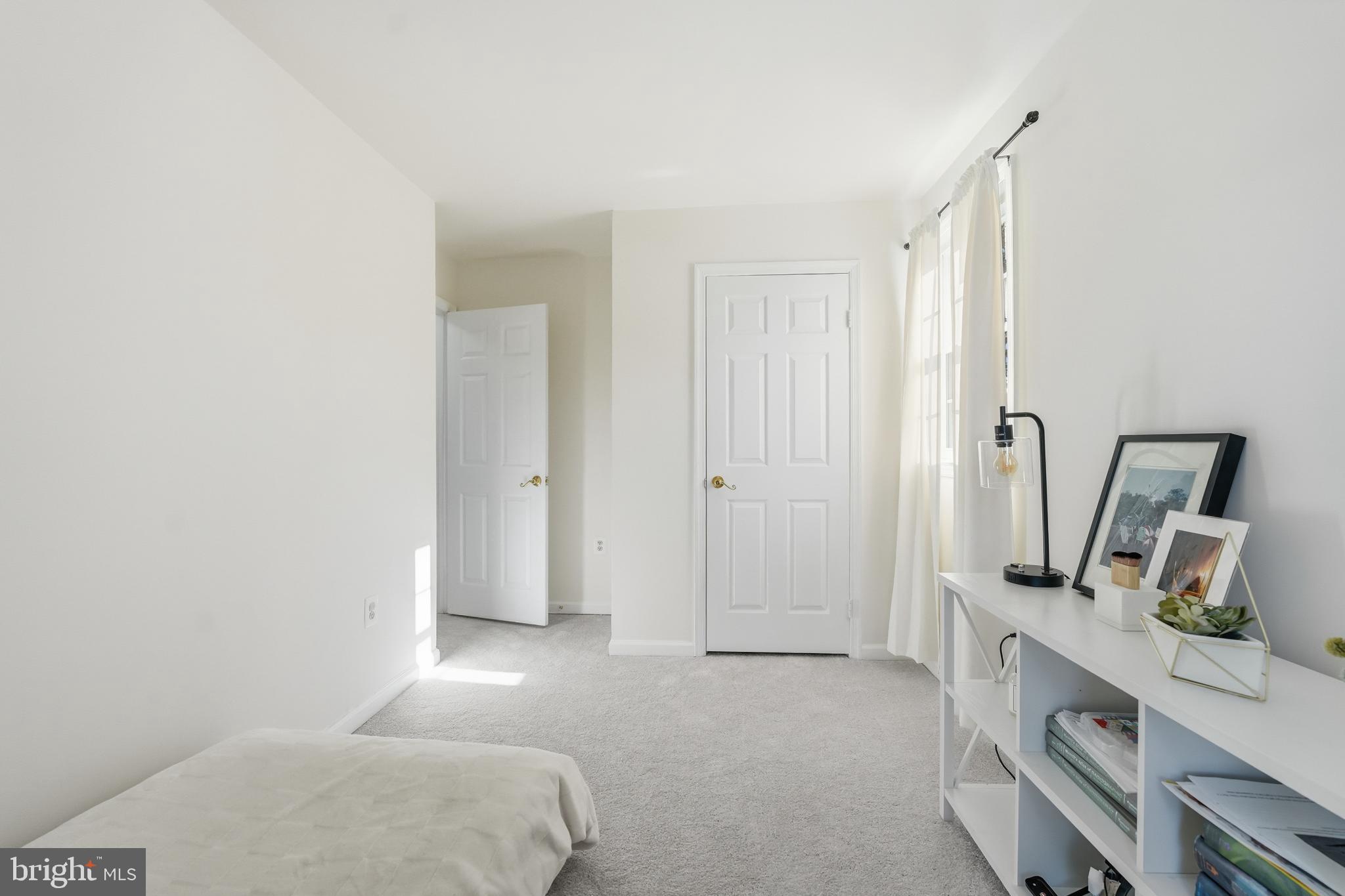 13709 Palm Road Woodbridge, VA 22193 - Photo 19 of 34 Bright and airy minimalist bedroom space.