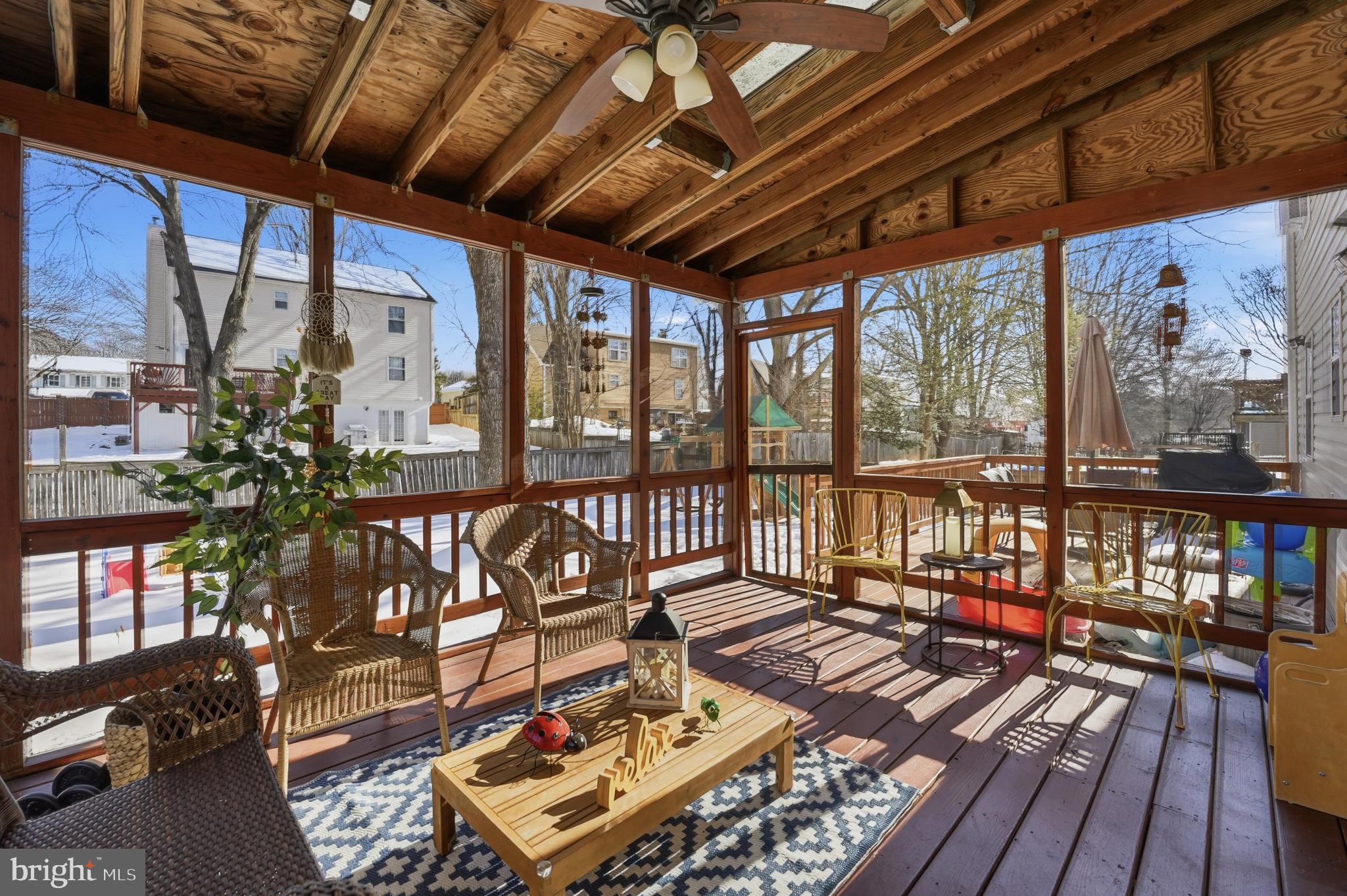 13709 Palm Road Woodbridge, VA 22193 - Photo 30 of 34 Charming screened porch bathed in sunlight.