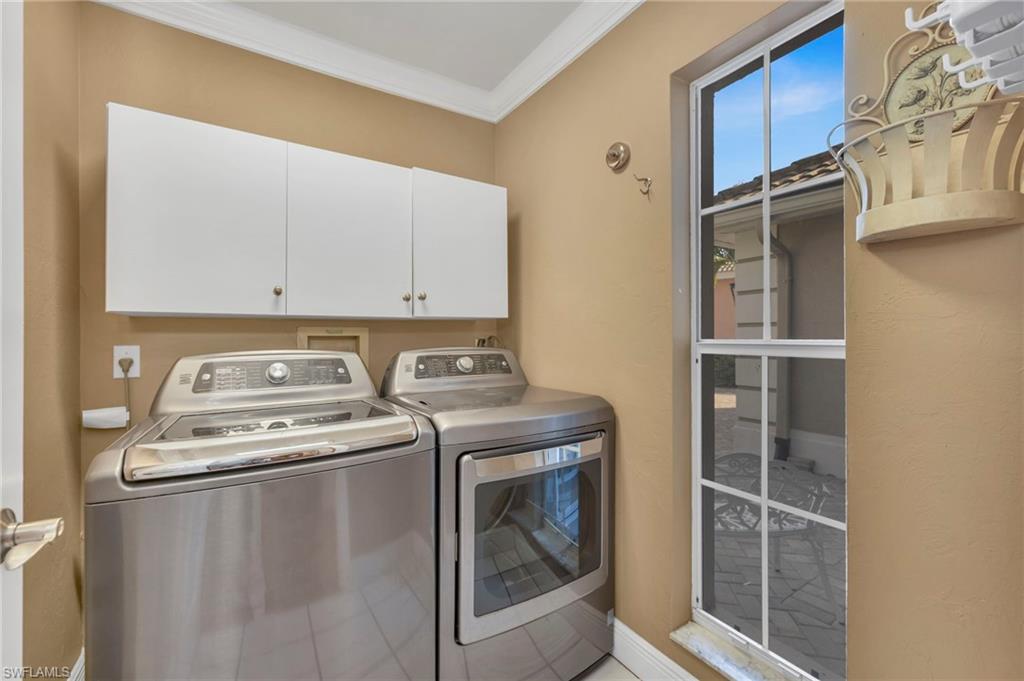 5101 Mabry Drive Naples, FL 34112 - Photo 14 of 18 a utility room with dryer and washer