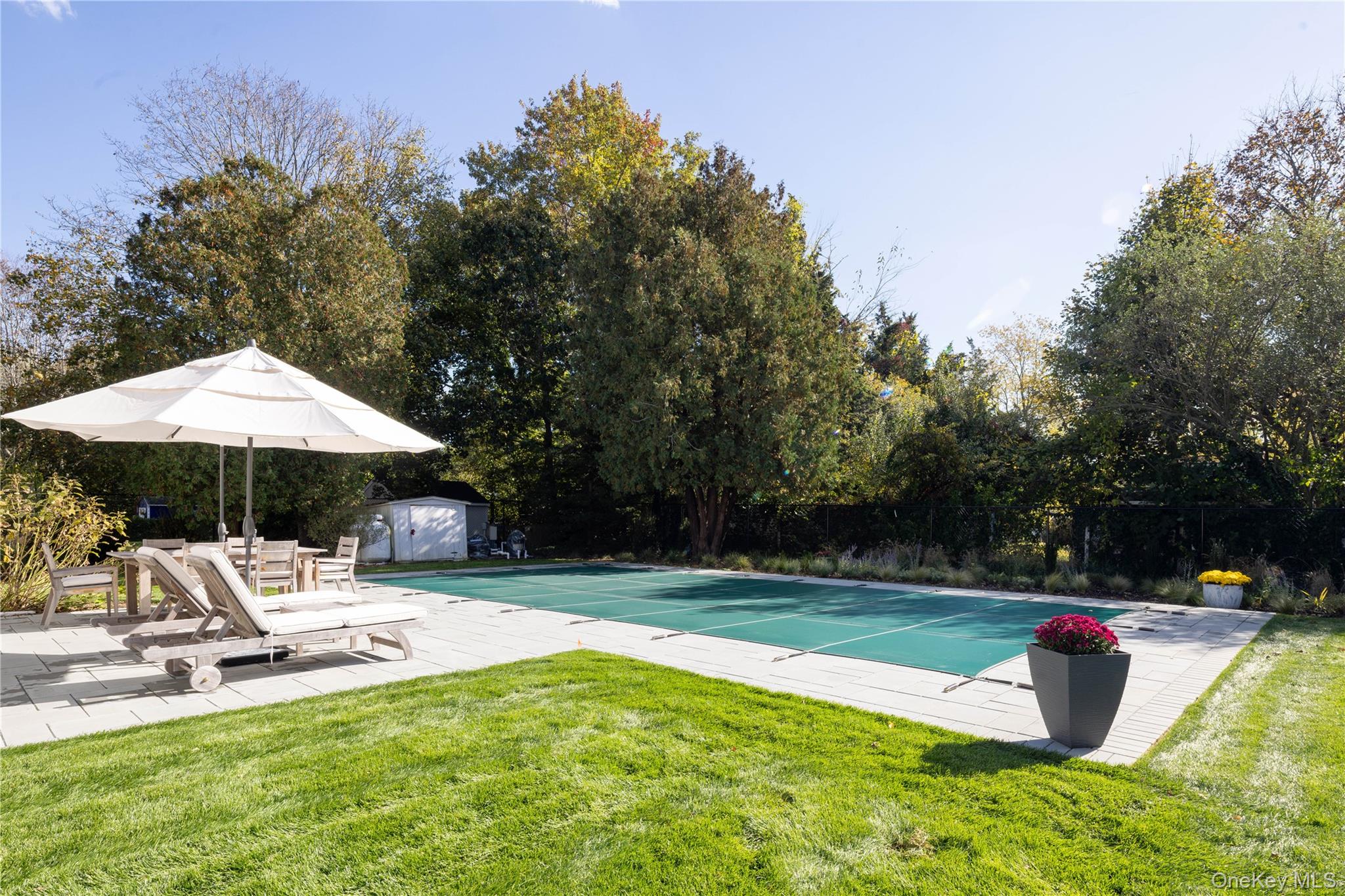 920 Pine Neck Road Southold, NY 11971 - Photo 19 of 28 a swimming pool with barbeque and outdoor seating