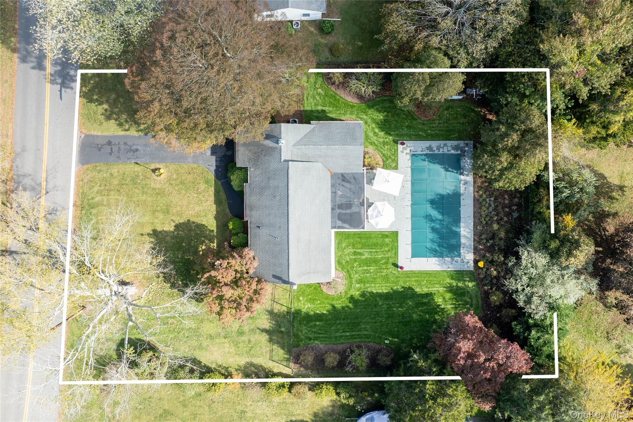 920 Pine Neck Road Southold, NY 11971 - Photo 22 of 28 an aerial view of a house with a yard