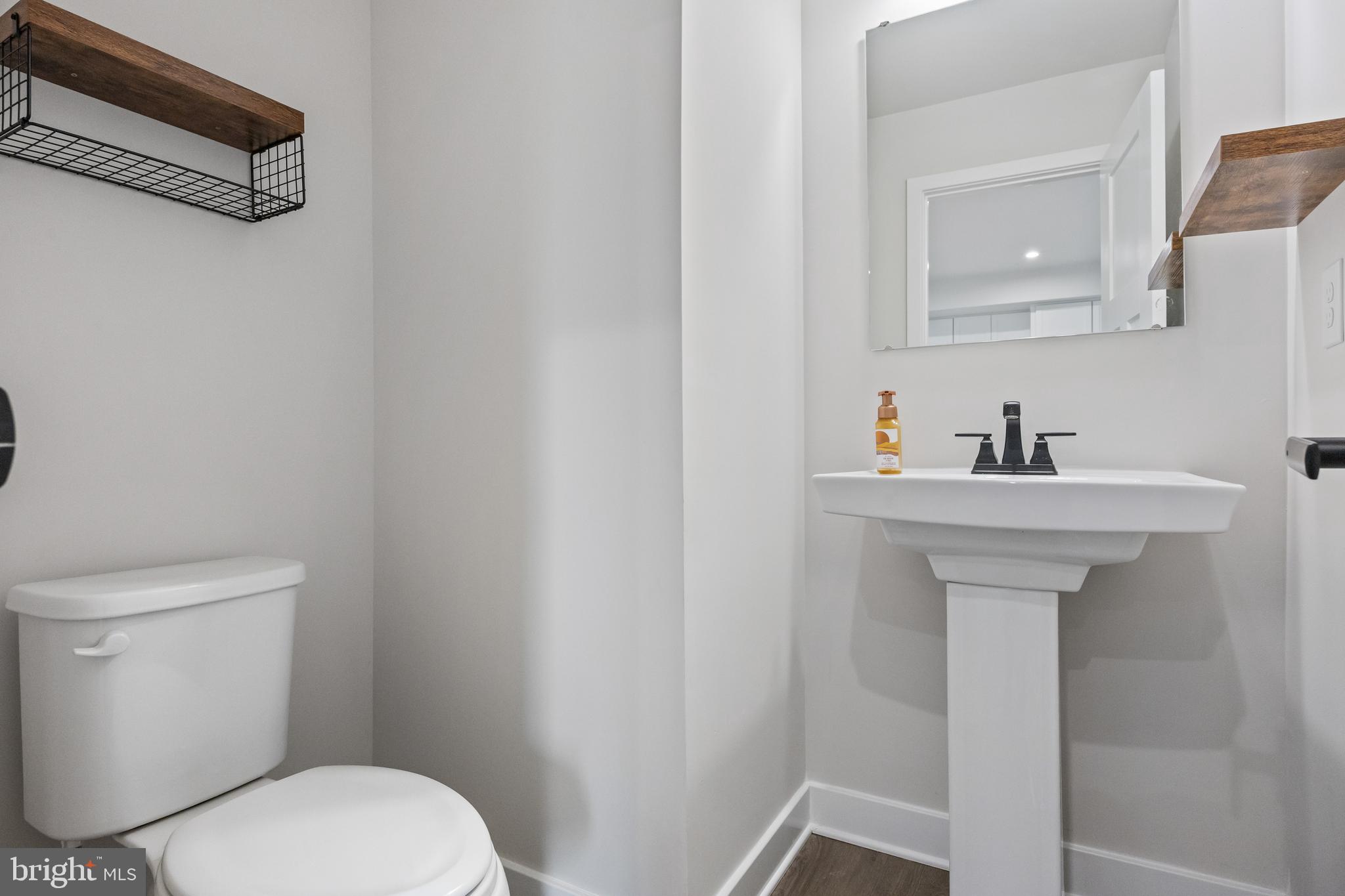 2 Rosemary Way Mount Laurel, NJ 08054 - Photo 13 of 28 a bathroom with a sink a mirror and a toilet