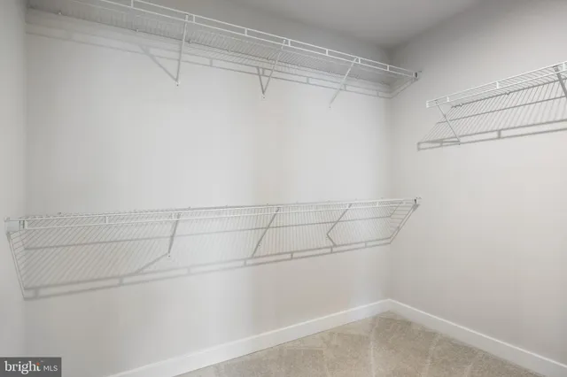 a view of a room with racks on the wall