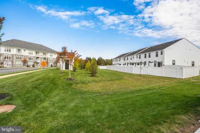 a view of a big yard with an apartment