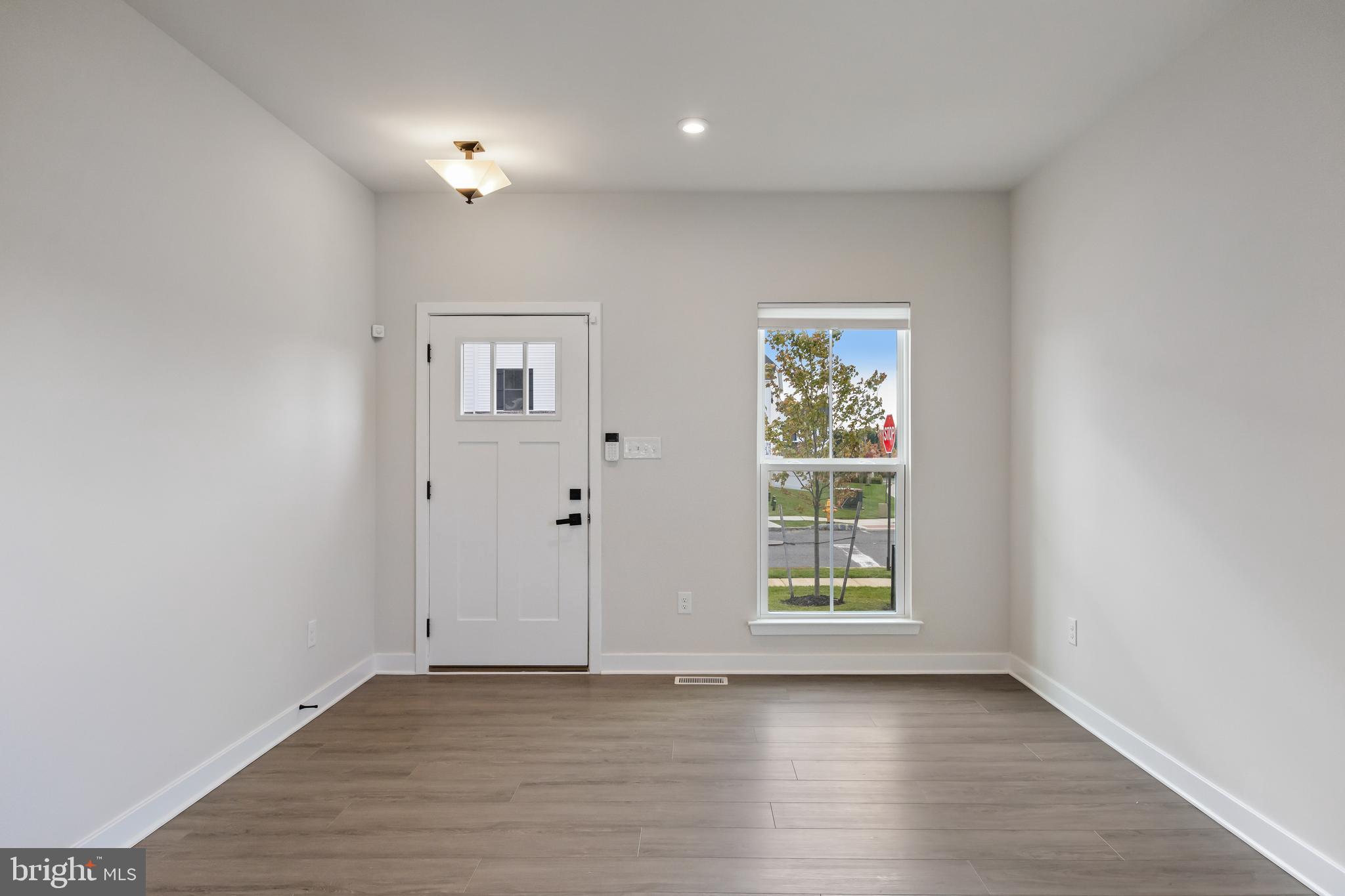 2 Rosemary Way Mount Laurel, NJ 08054 - Photo 3 of 28 an empty room with wooden floor and windows