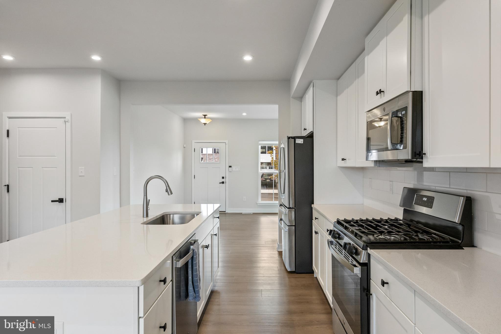 2 Rosemary Way Mount Laurel, NJ 08054 - Photo 7 of 28 a kitchen with kitchen island a sink stove and refrigerator