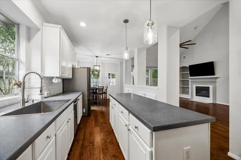 a kitchen with a stove and a sink