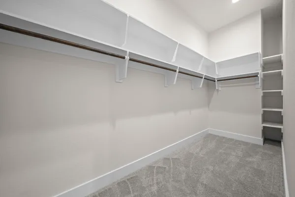 a view of a room with shelf on the wall