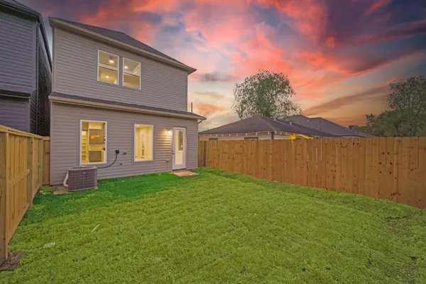 a view of backyard with a garden and plants